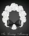 Funeral card. White roses wreath and black bow ribbon on the dark background
