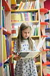 girl of 8 years old visiting library.