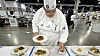 Valencia High and Central New Mexico Community College graduate Elian Estrada sets up his entrees during the the Skill USA Championship culinary competition in Atlanta.