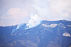 Fire crews continue to work on containing a fire on the west side of the Manzano Mountains, which can be seen throughout Valencia County.